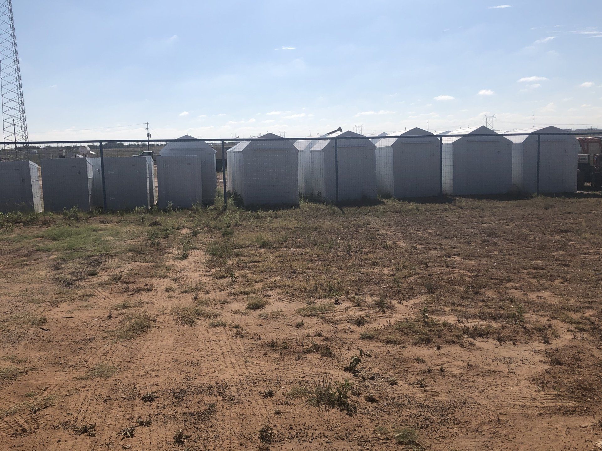 white sheds lined up