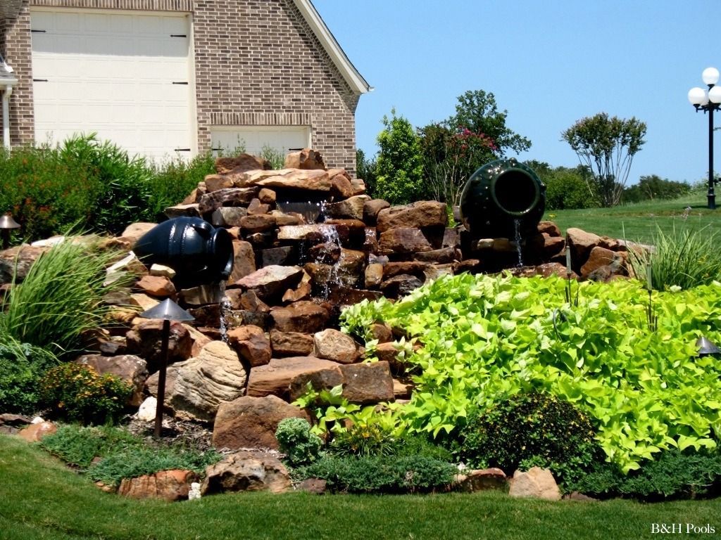 A house with a waterfall in front of it