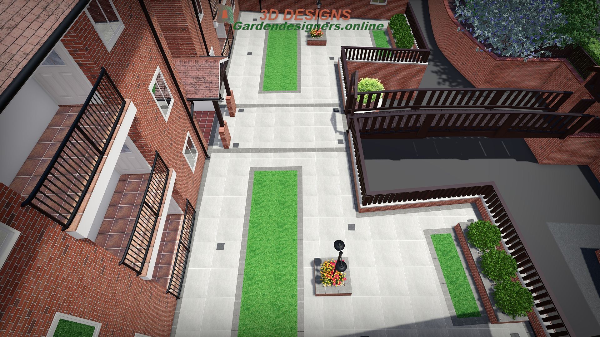 An aerial view of a brick building with a green lawn in the middle.