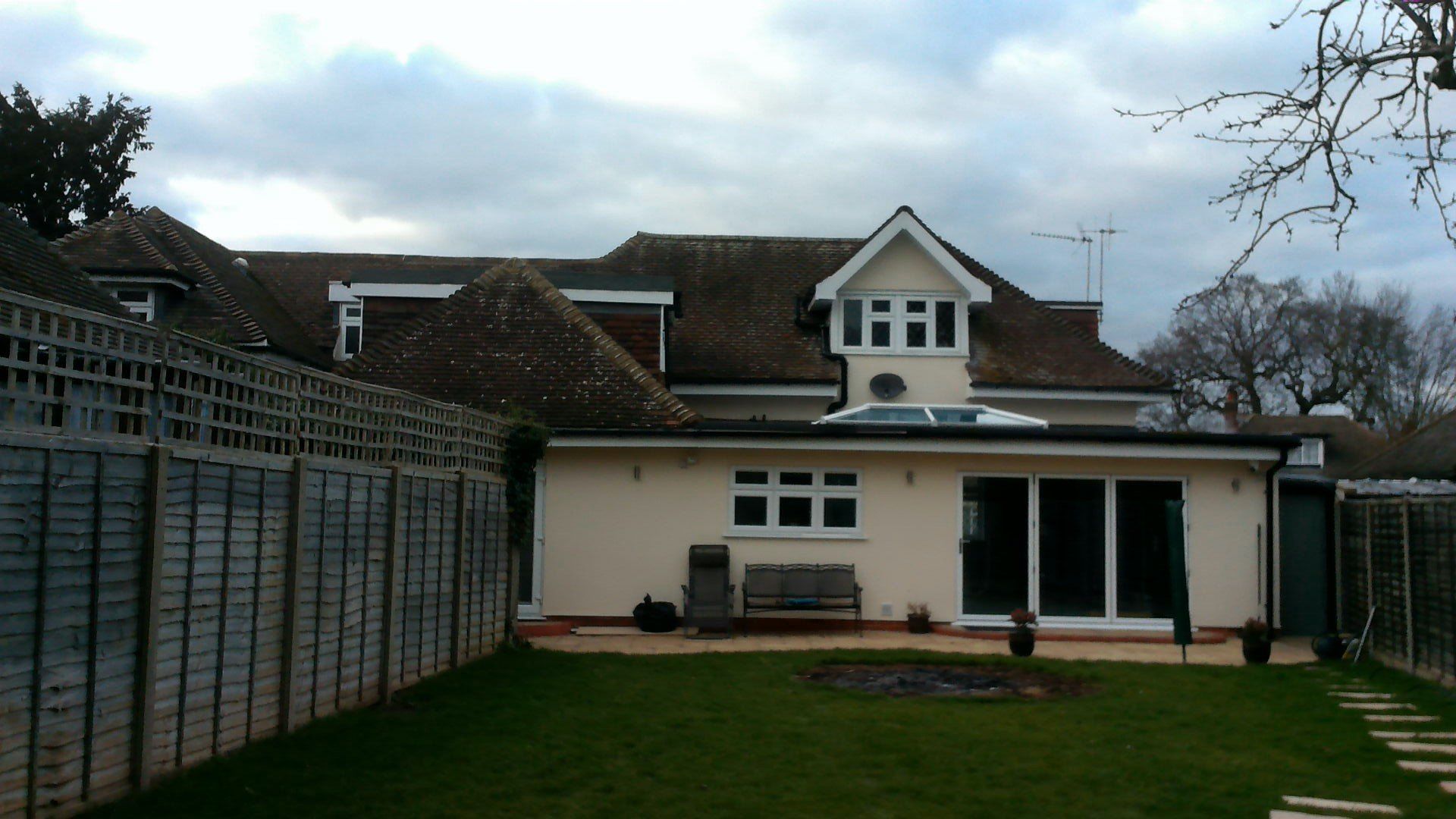 A large house with a fence in front of it