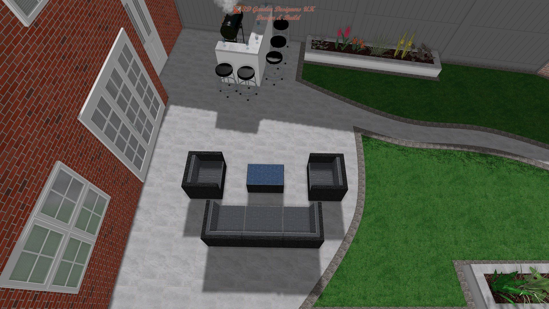 A brick building with a patio with a couch and chairs in front of it.
