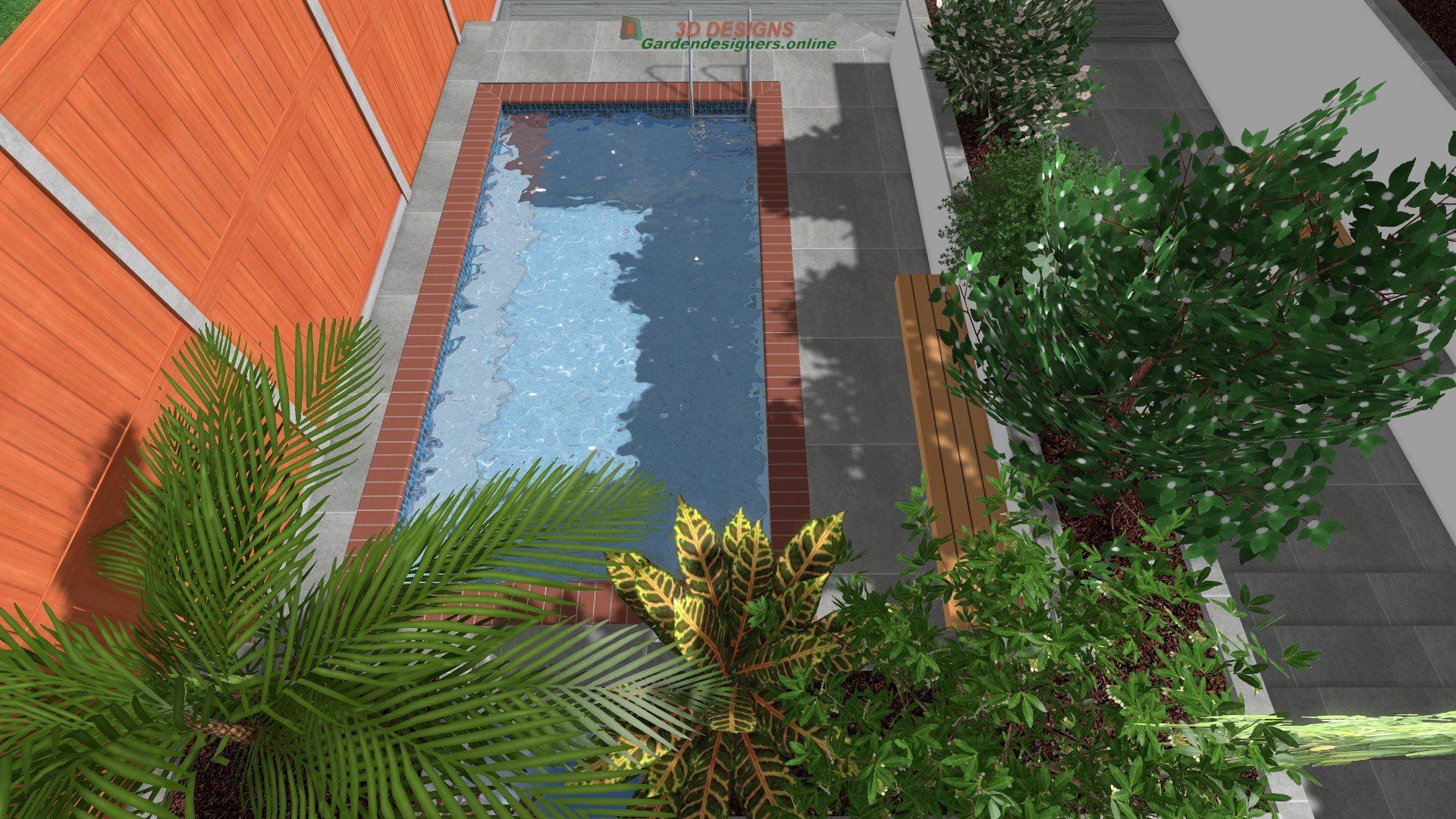 An aerial view of a swimming pool surrounded by trees and a wooden fence.