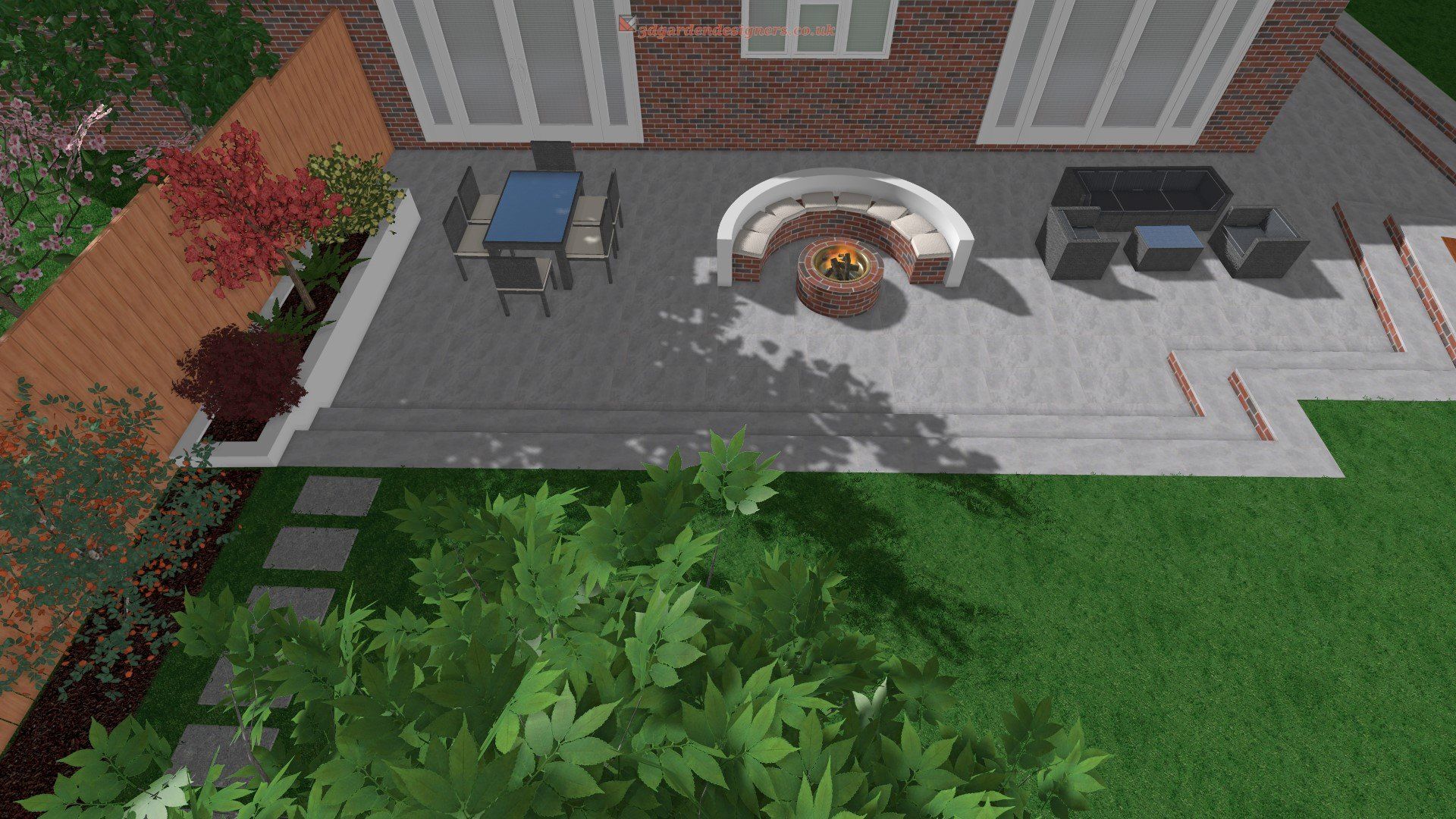 An aerial view of a patio with a fire pit and a table and chairs.