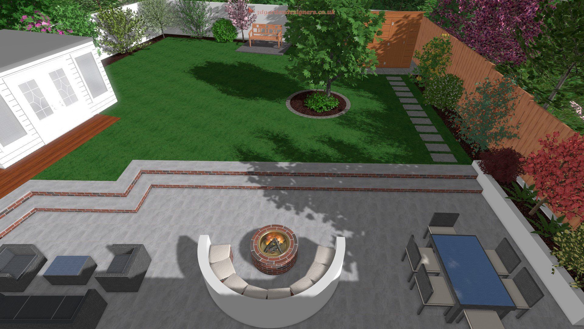 An aerial view of a backyard with a fire pit and patio furniture.