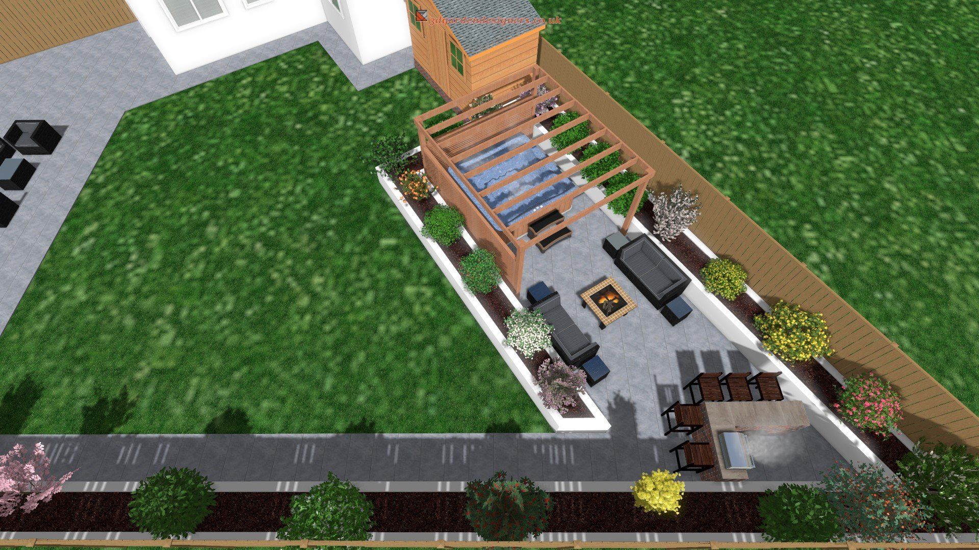 An aerial view of a backyard with a pergola and patio furniture.