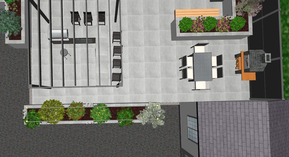 An aerial view of a patio with a table and chairs and a grill.