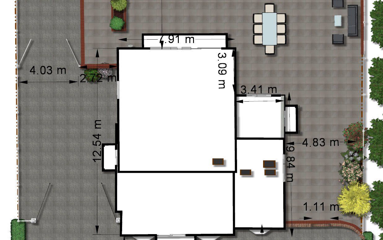 An aerial view of a house with a table and chairs