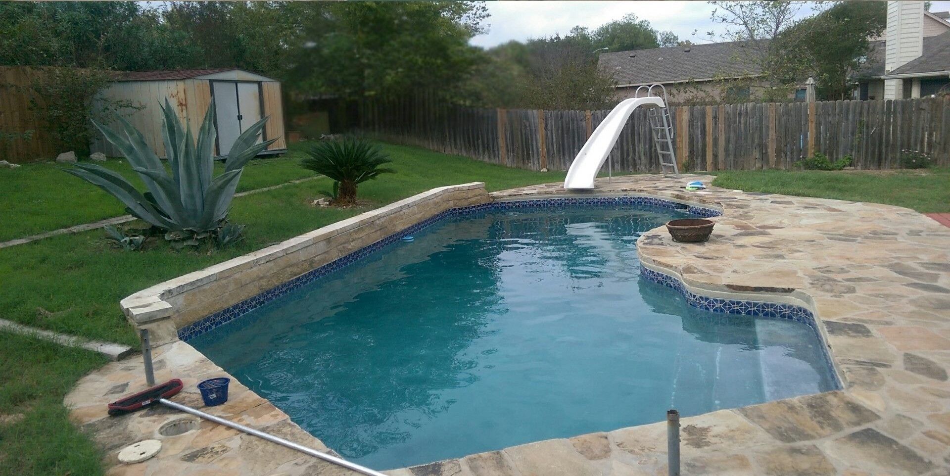 Two views of a backyard pool before and after being cleaned, with water turning from green to blue.