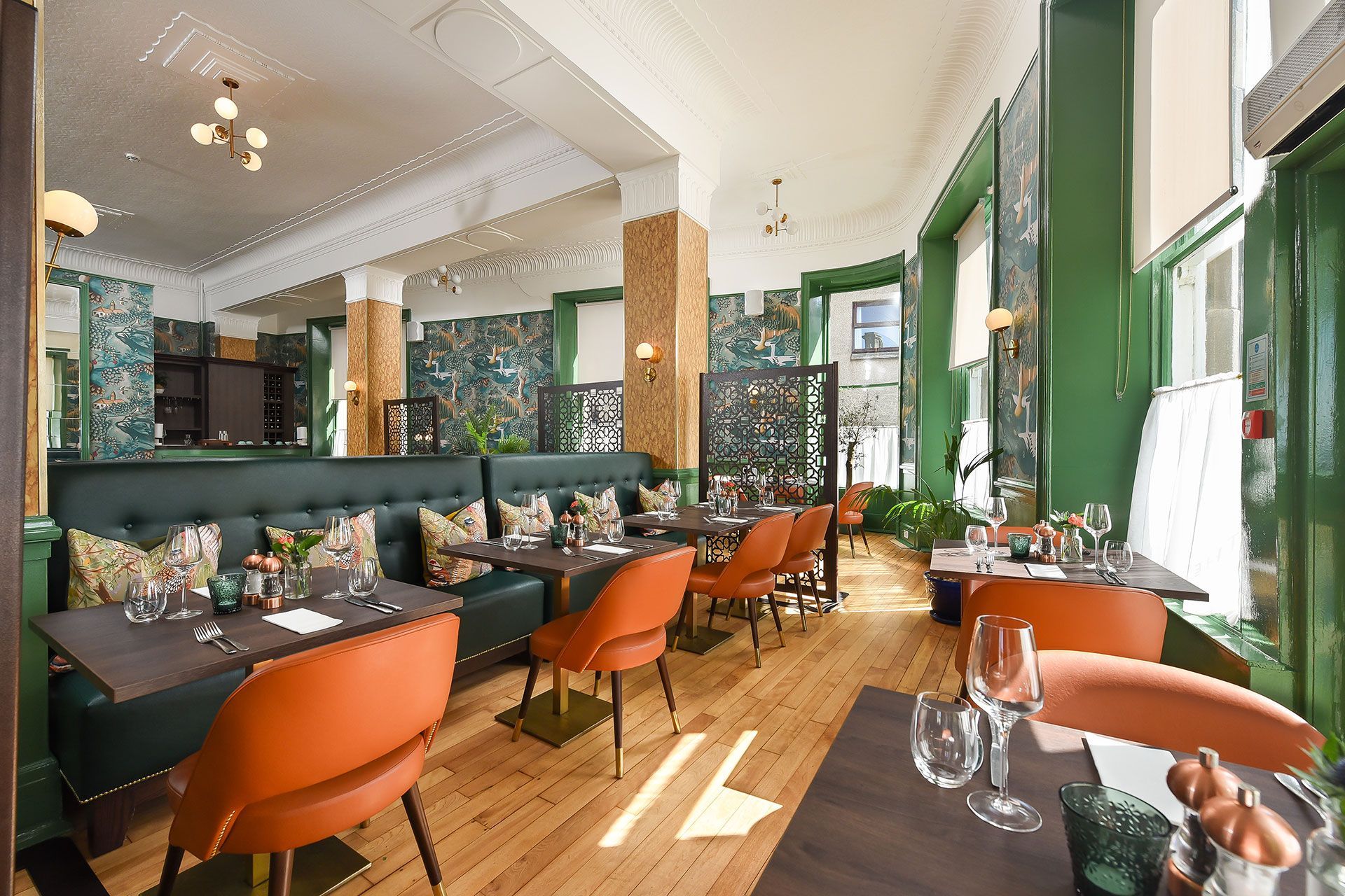 There are many tables and chairs in the restaurant.