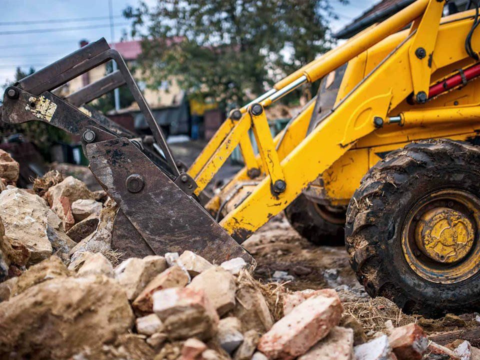 Rocks And Bulldozer — Bairnsdale, VIC — Sproule’s Demolition & Asbestos Removal