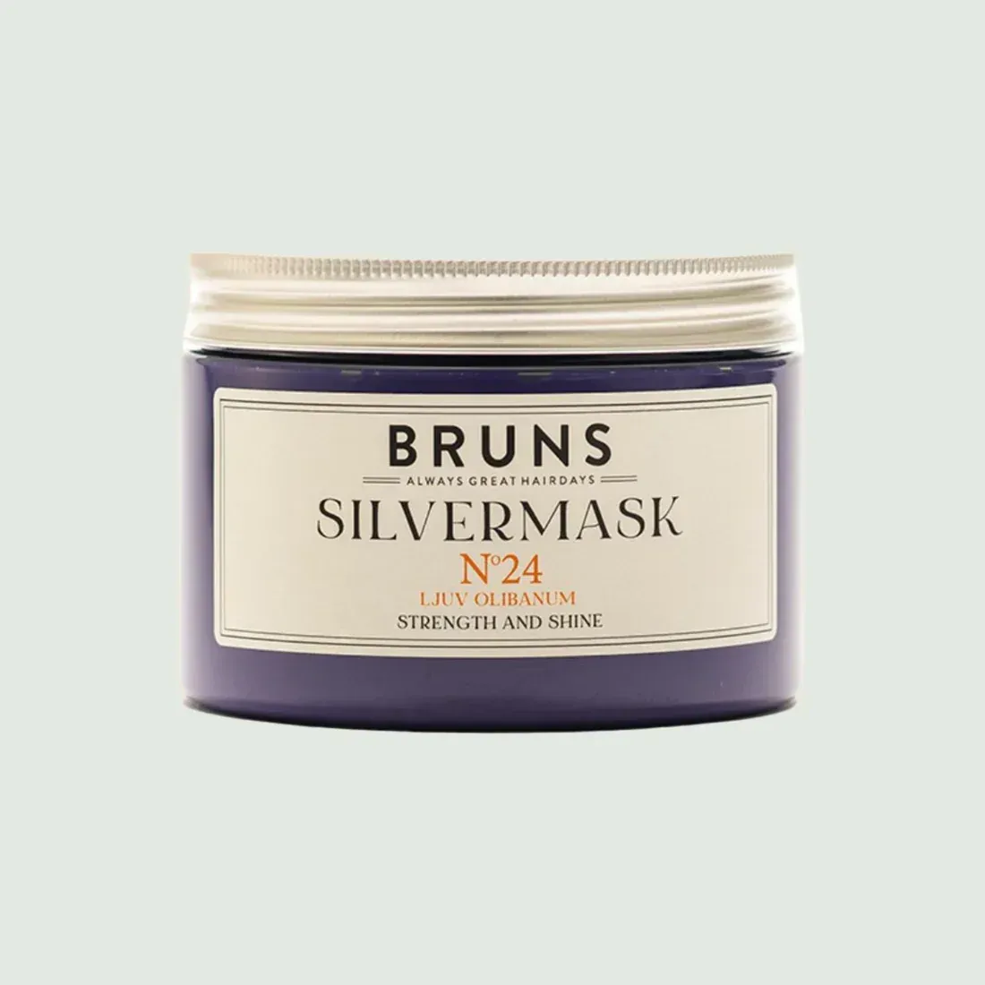 Een donkerpaarse pot BRUNS Silvermask nr. 24 met een zilveren deksel, gecentreerd tegen een lichtgrijze achtergrond.