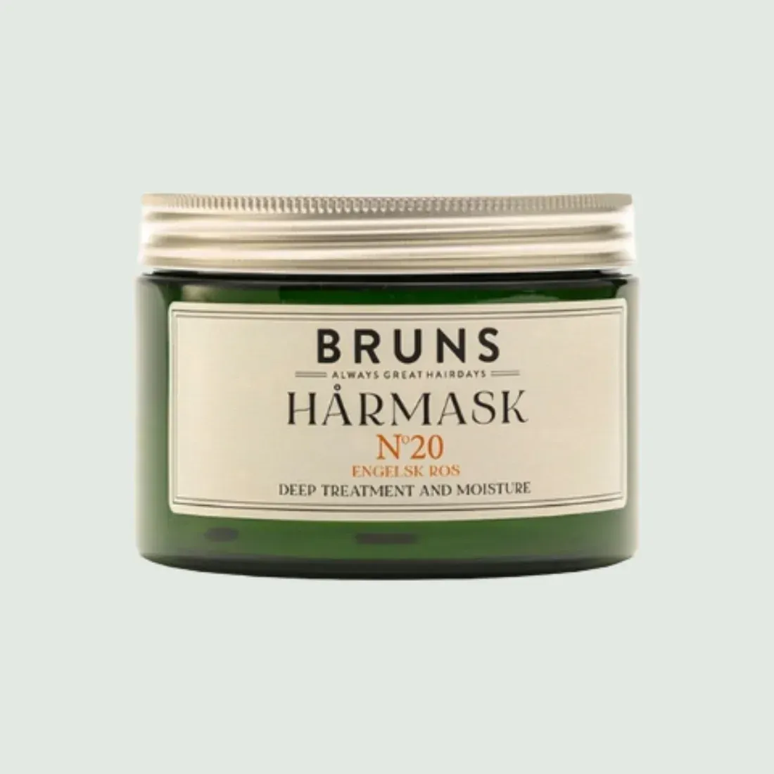 Een groene pot Bruns Hårmask No. 20 haarmasker met een zilverkleurig deksel en een crèmekleurig etiket.
