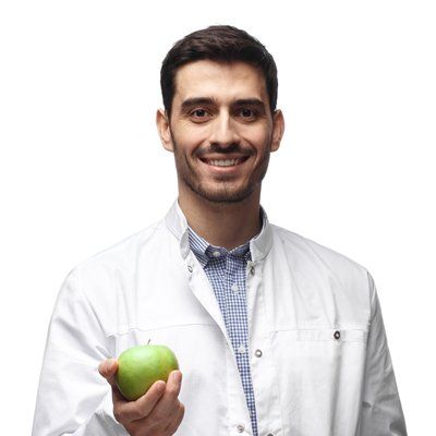 Balanced Diet — Dentist Holding Apple in Modesto, CA