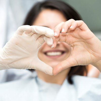 Teeth Whitening — Heart Hand Sign in Modesto, CA