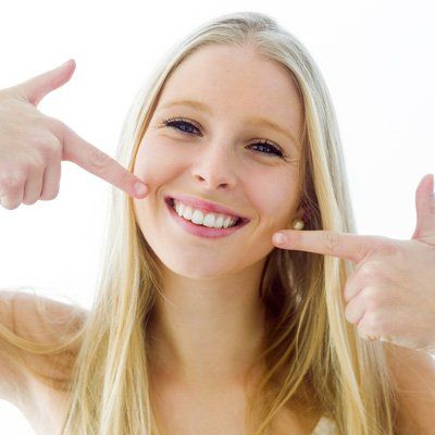 Dentures — Girl Pointing Teeth in Modesto, CA