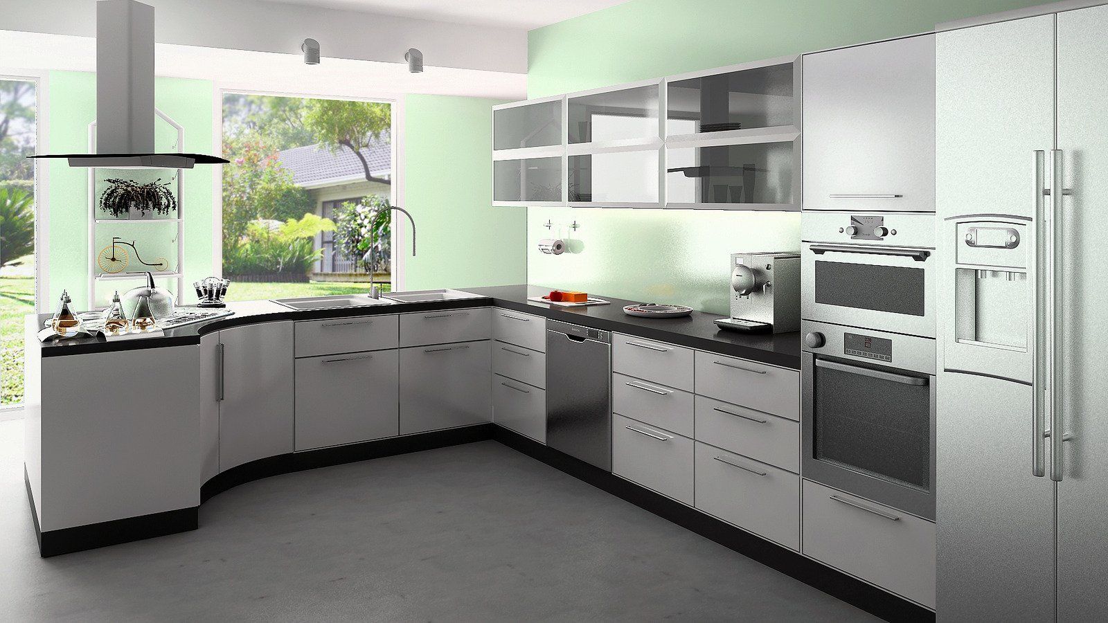 Modern white kitchen with a wrap-around counter, built-in appliances, and a large window overlooking a yard.