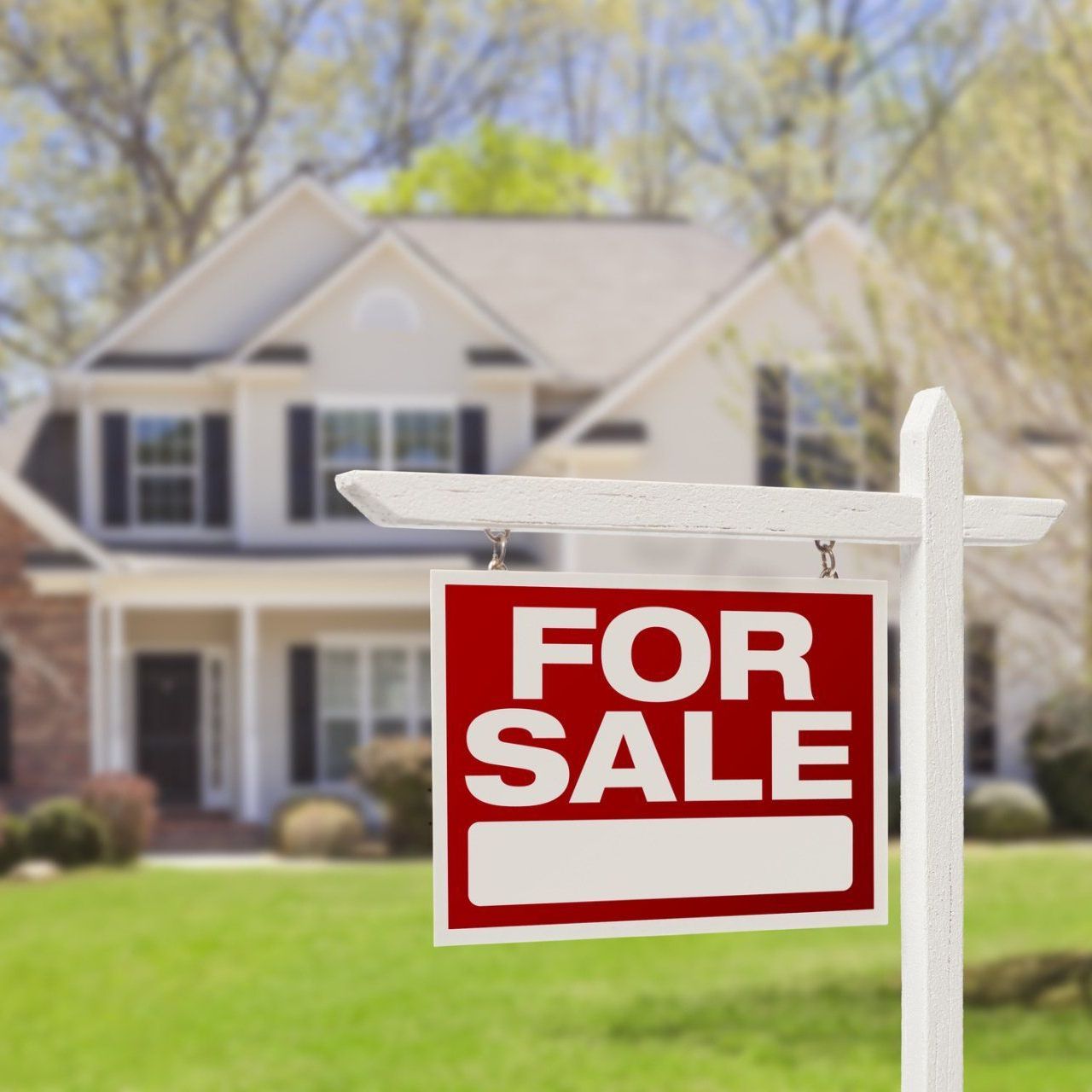 For sale sign in front of a house