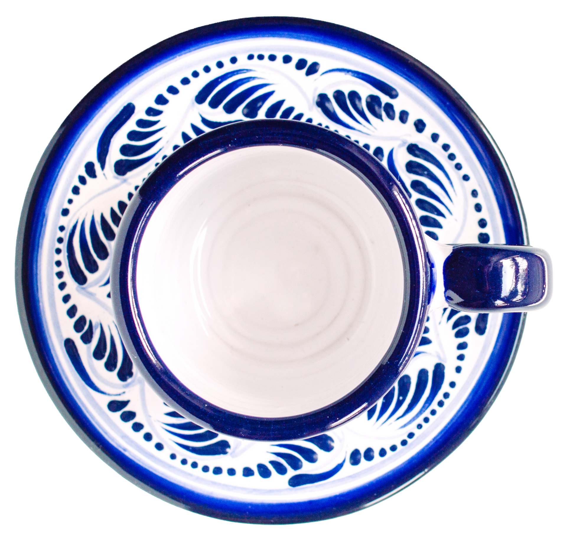 Blue and white Talavera ceramic teacup and saucer, overhead view.