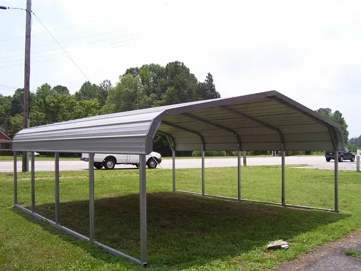 a white truck is parked under a metal carport