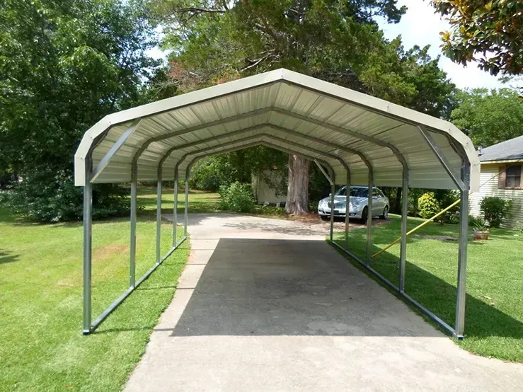 a white car is parked under a metal carport