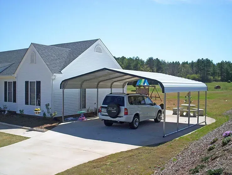 a white car is parked under a metal carport