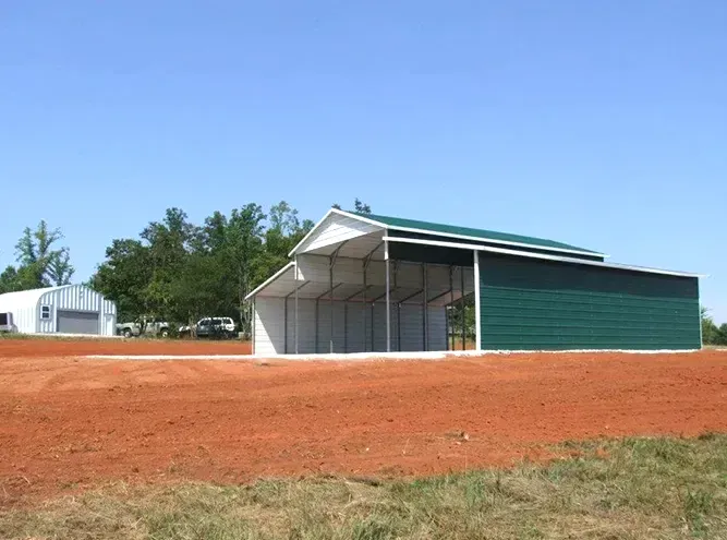 a white garage with two black garage doors