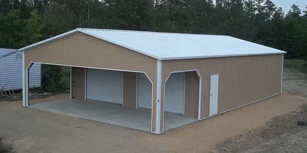 A metal garage with two garage doors and a white roof.