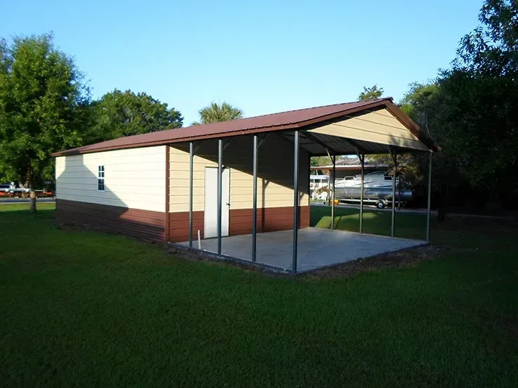 a brown and white building with a porch on the side