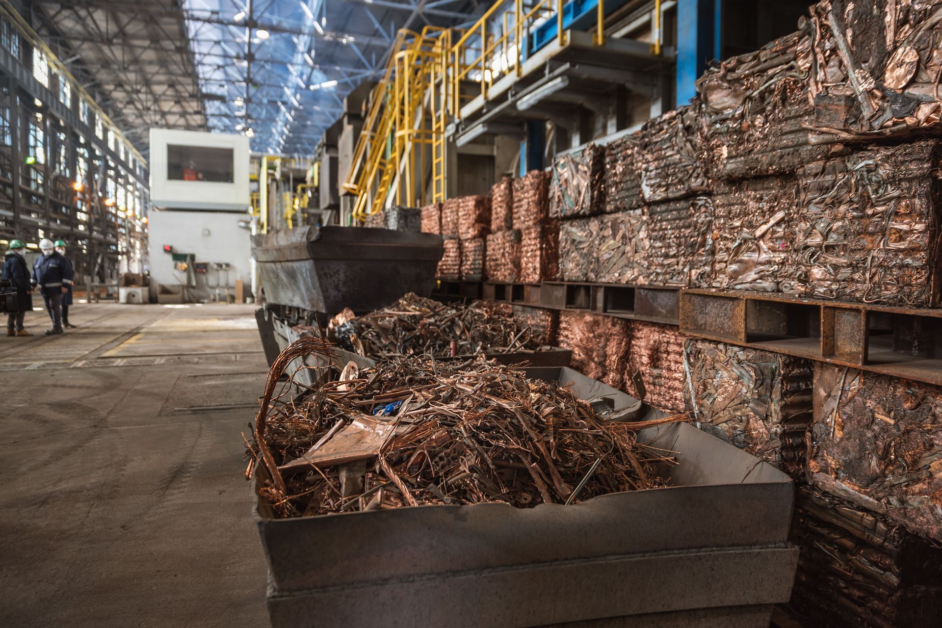 Copper scraps are in bins and prepared for recycling at a copper smelter.