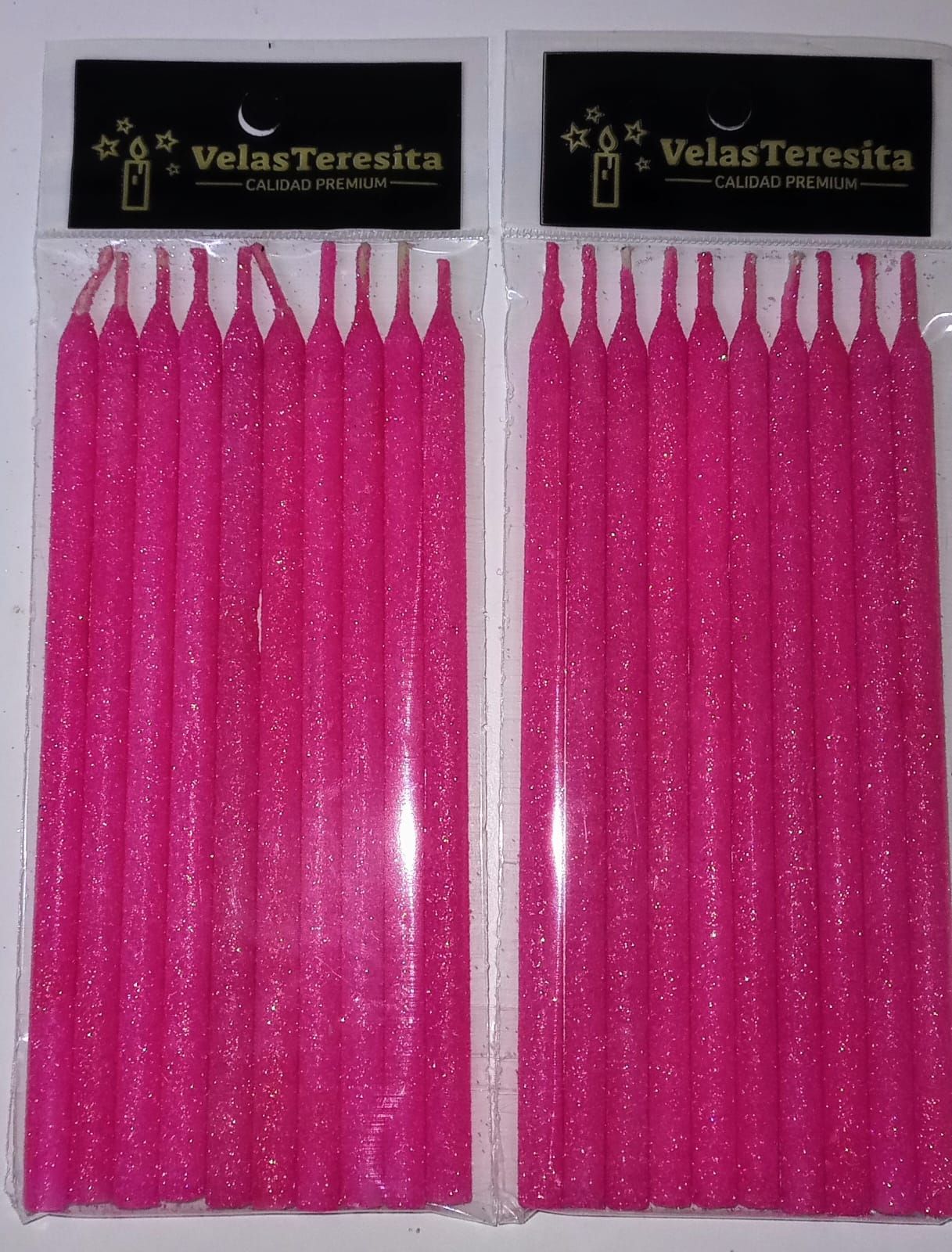 Dos paquetes de velas de cumpleaños con purpurina rosa en envase plástico, con la marca