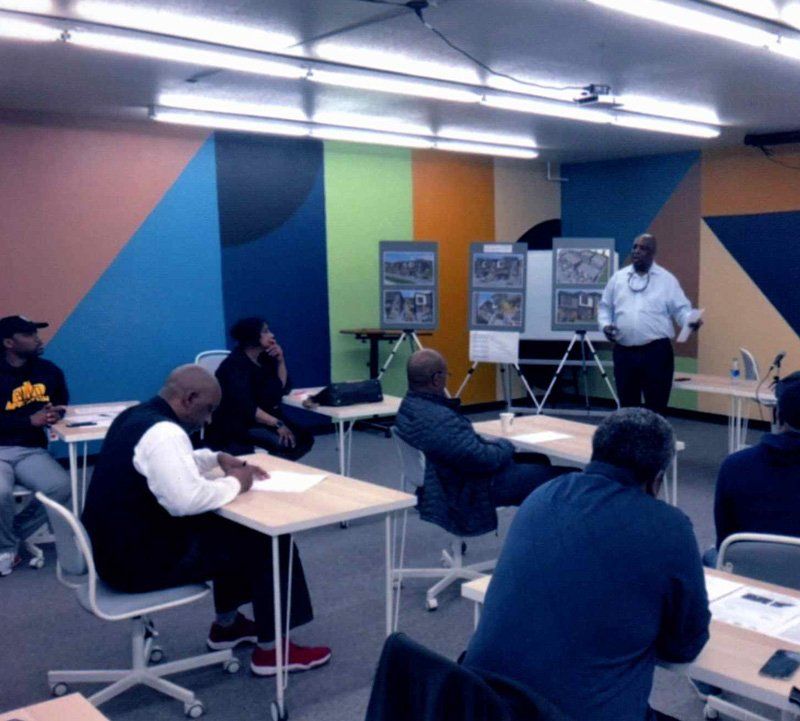 Instructor In Front Of Group Of People — St. Louis, MO — Contract Design & Development, LLC