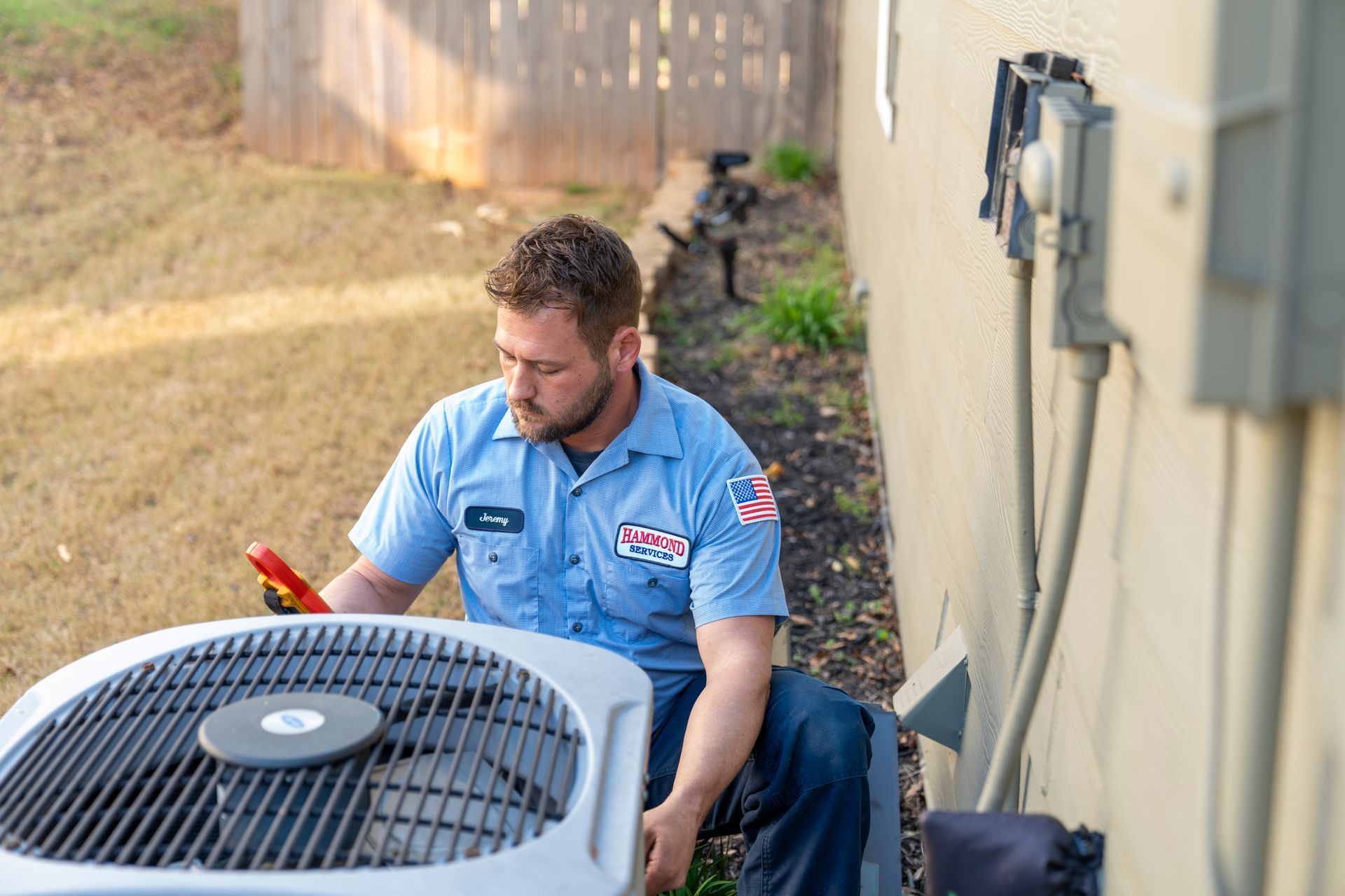 HVAC Tech working on AC Unit