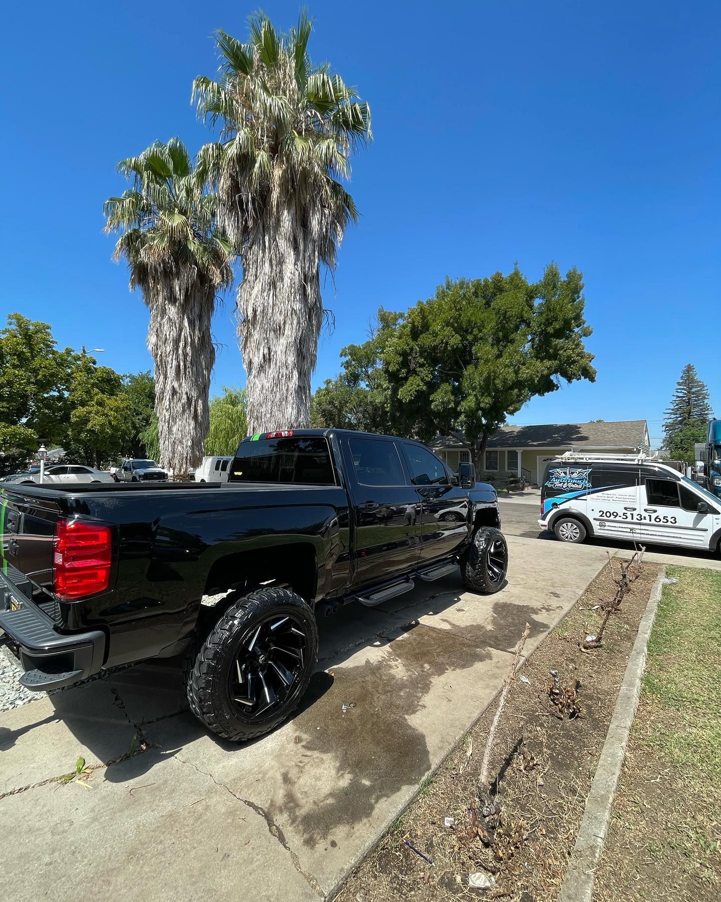 A toyota tundra is parked in a driveway next to a house.