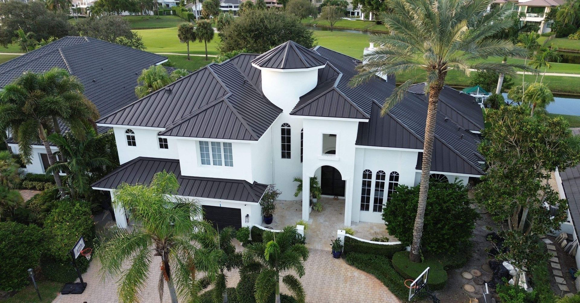New metal roof installation in Boca Raton St Andrews Country Club  with Englert 1.5 system Dark Bronze premium underlayment.
