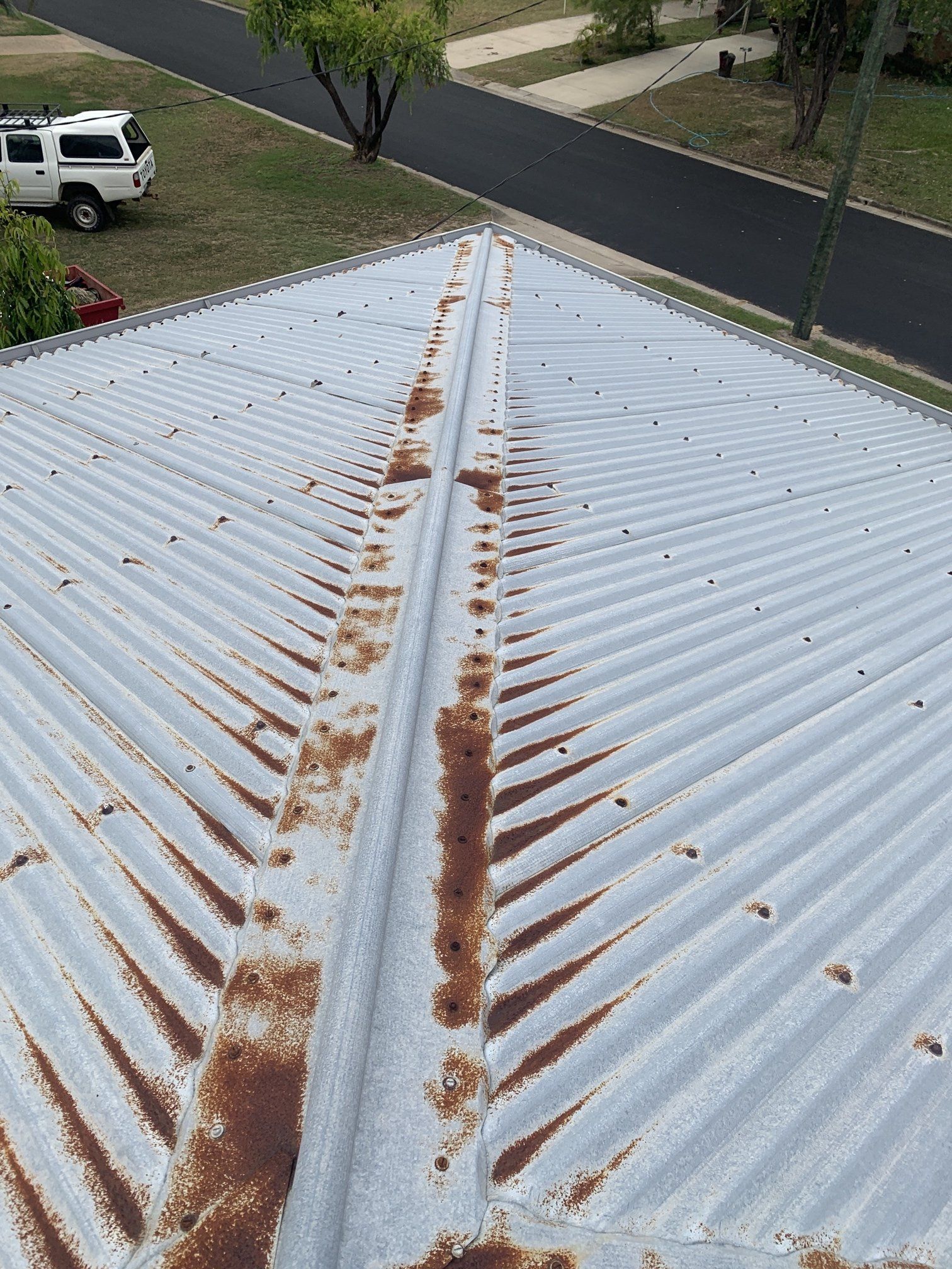 Rusty Roof Before Roof Repair Coated Roof Gutter — Top To Bottom Plumbing