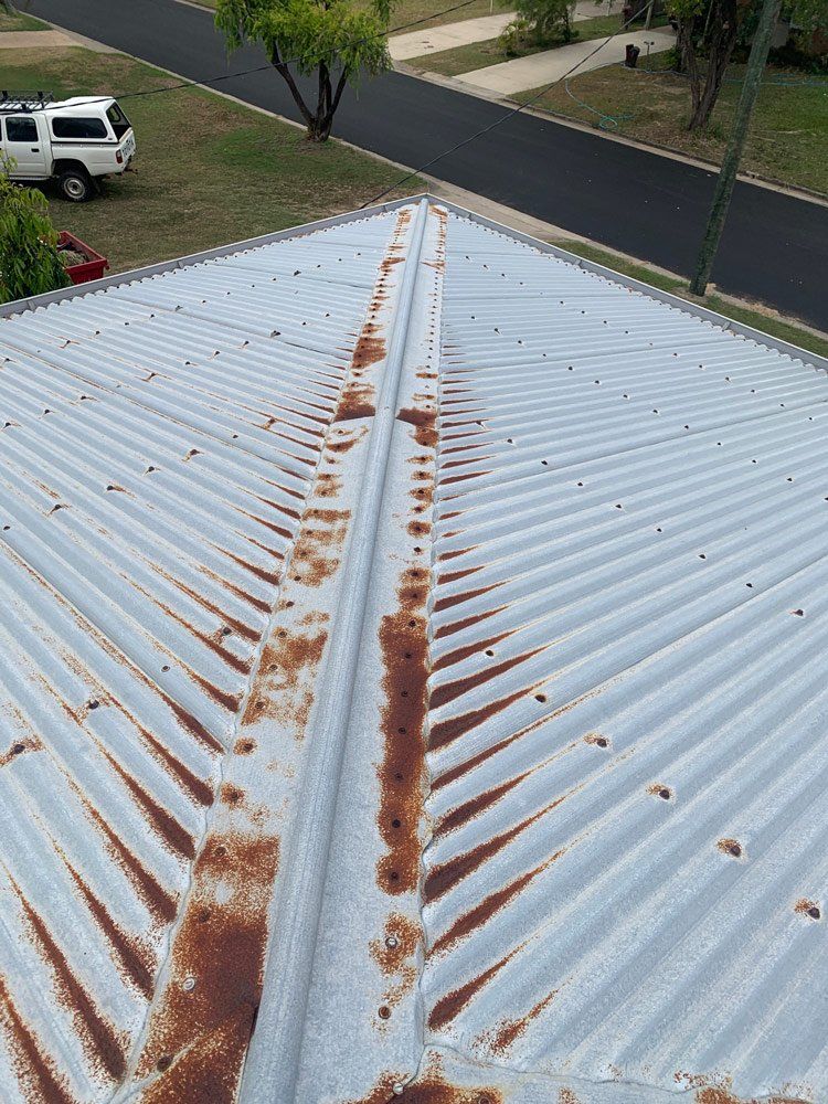 Tin Roof Before Restoration in Townsville — Top To Bottom Plumbing