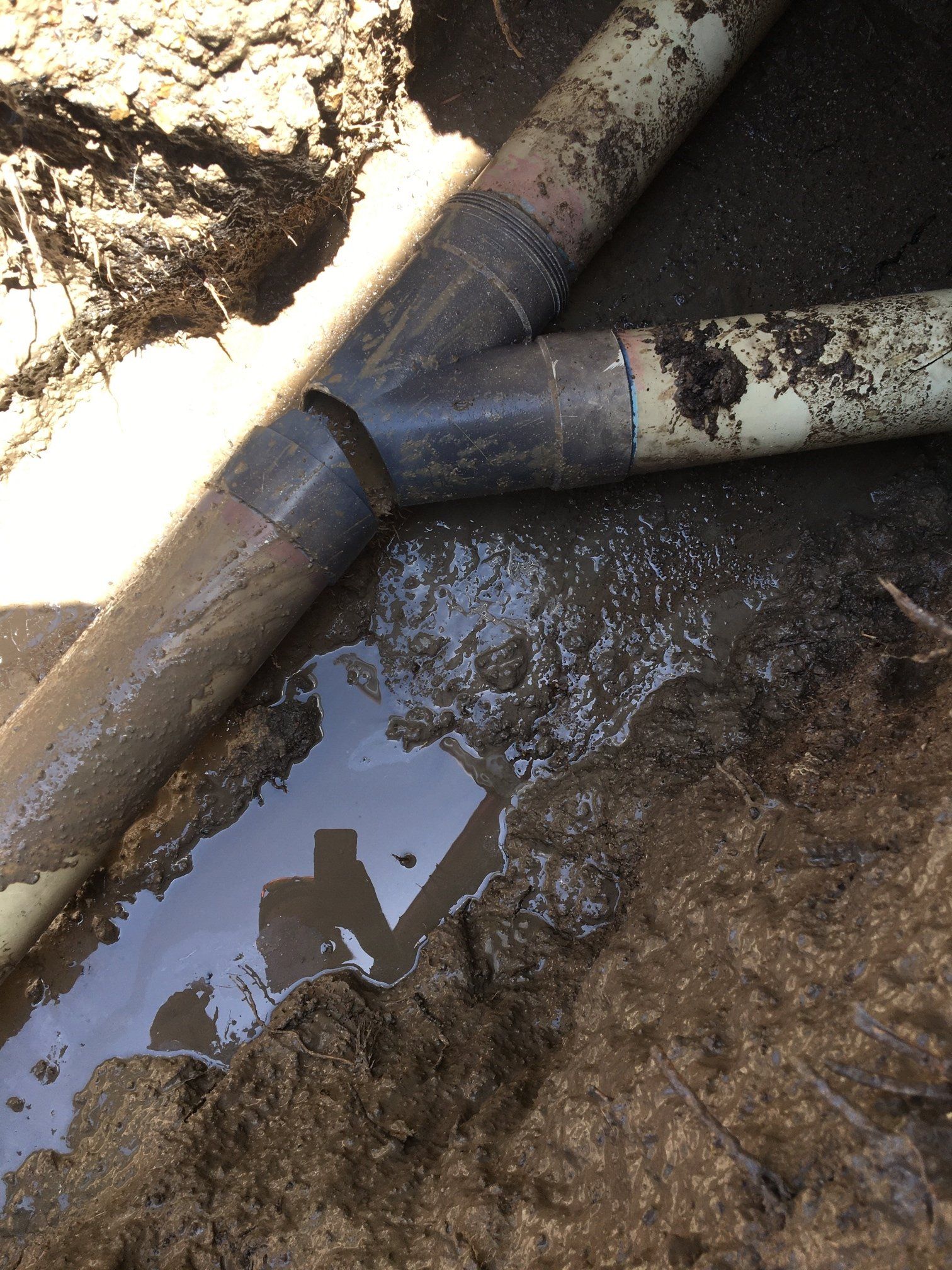 Plumber Fixing Leaking Drain Pipe — Plumber in Garbutt, QLD