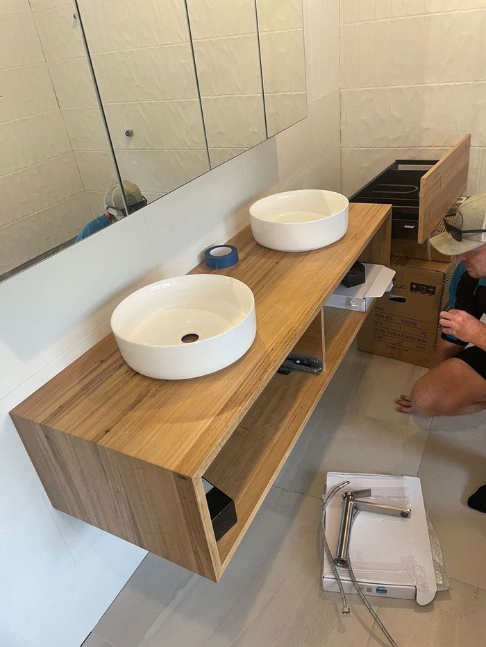 Plumber At Work In A Bathroom