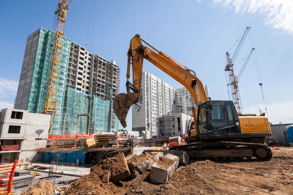 earth moving machine being used at a construction site