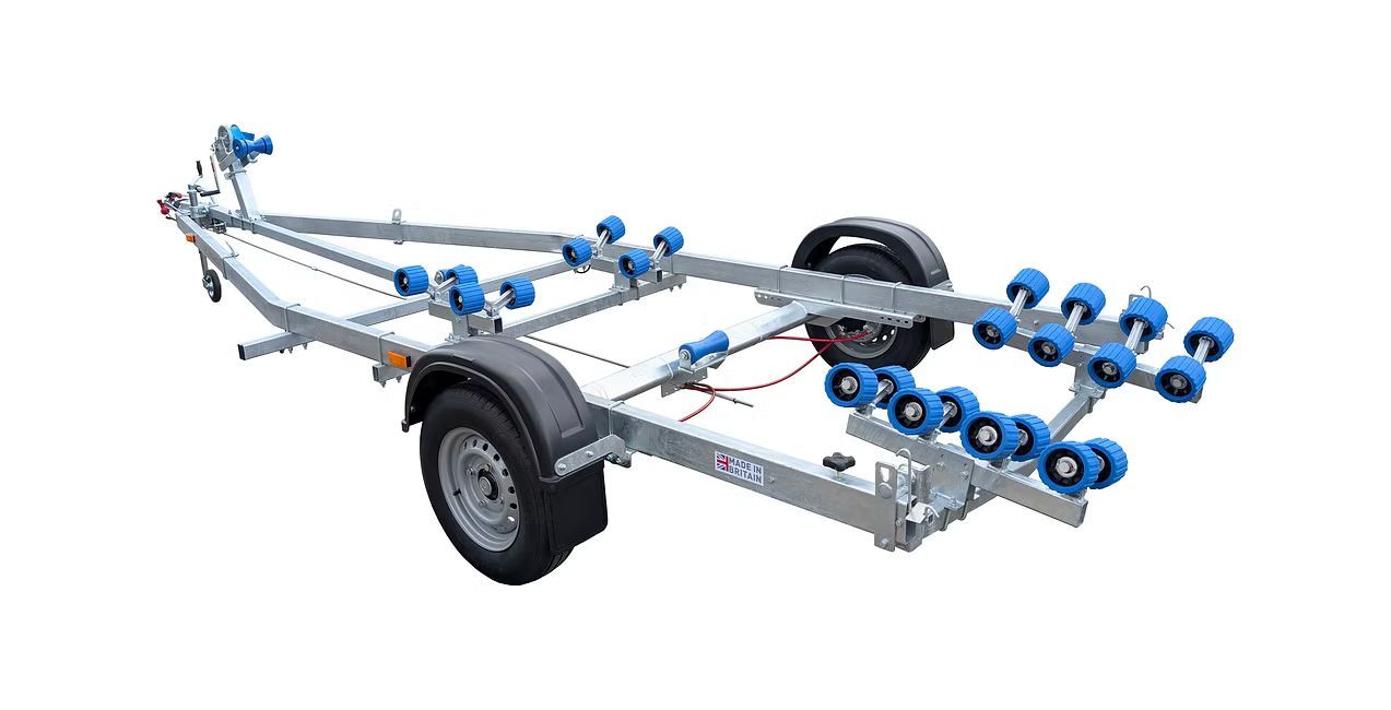 Boat trailer with blue rollers, gray frame, and black wheels.