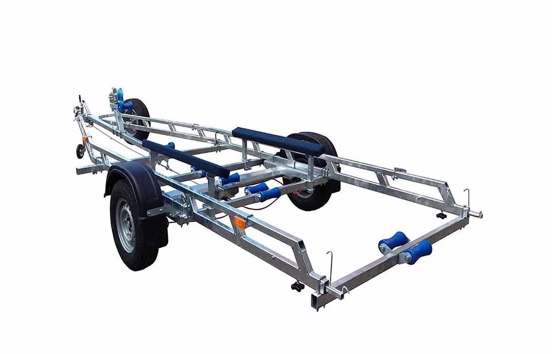 Boat trailer, silver frame, black fenders, blue rollers, for transporting watercraft.