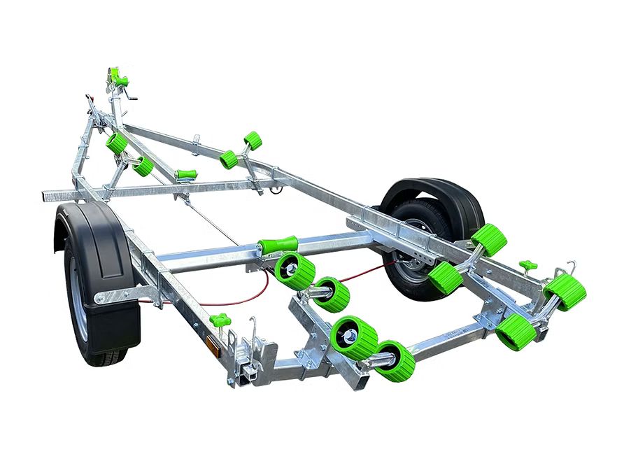 Silver boat trailer with black wheels and rollers on a white background.