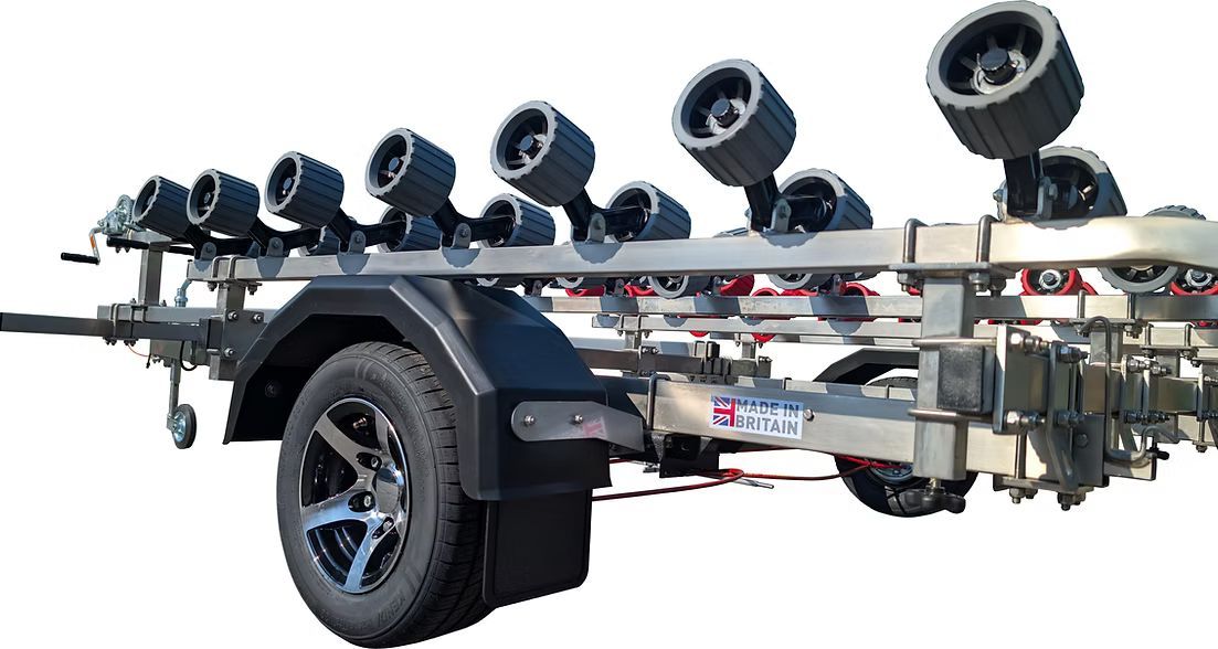 Boat trailer with rows of blue and red rollers.