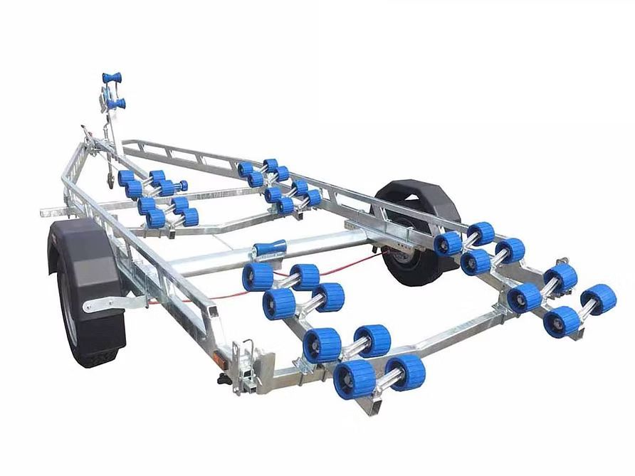 Boat trailer with blue rollers, gray frame, and black wheels.