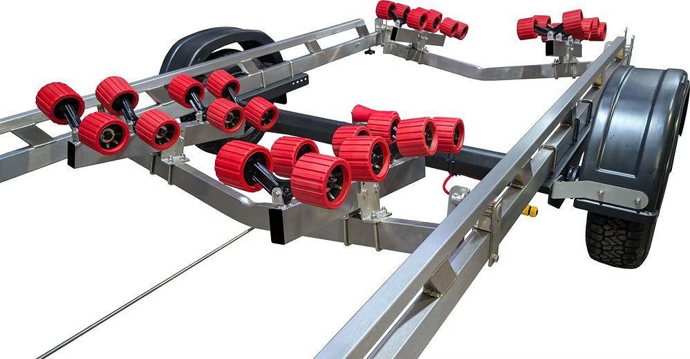 Boat trailer with red rollers, a winch, and a hitch, on a white background.