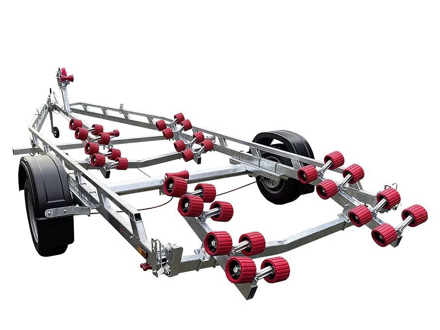 Boat trailer with red rollers, silver frame, and black tires.