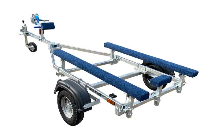 Boat trailer with blue padded supports, black fenders, and a winch, on white background.