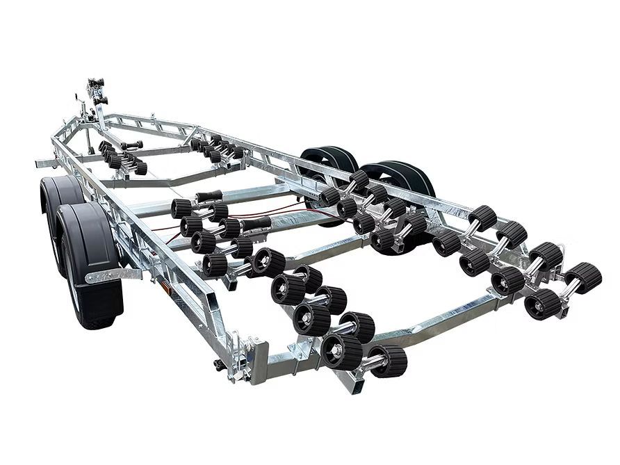 Boat trailer with multiple black rollers and tires.