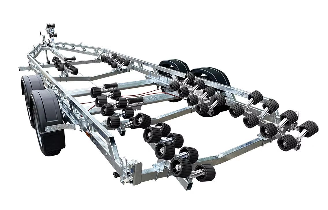 Boat trailer with multiple black rollers and tires.