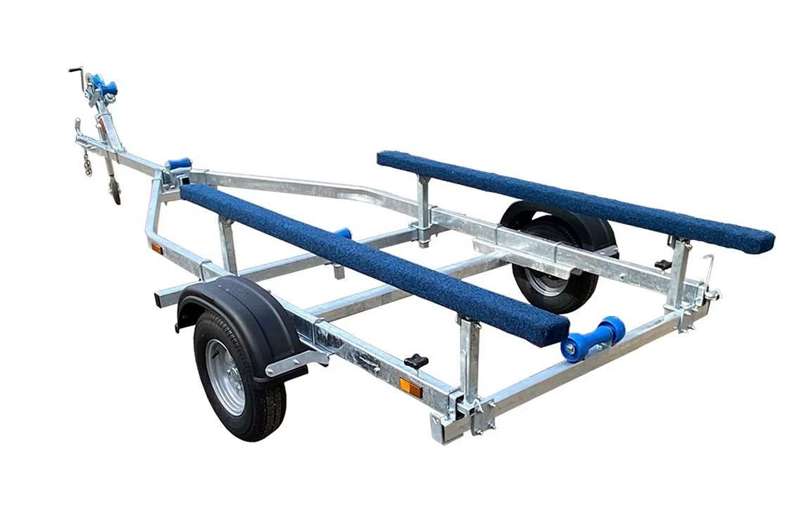 Boat trailer with blue padded supports and black tires.